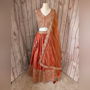 Rust Orange And Gold Embellished Lehenga Choli Set